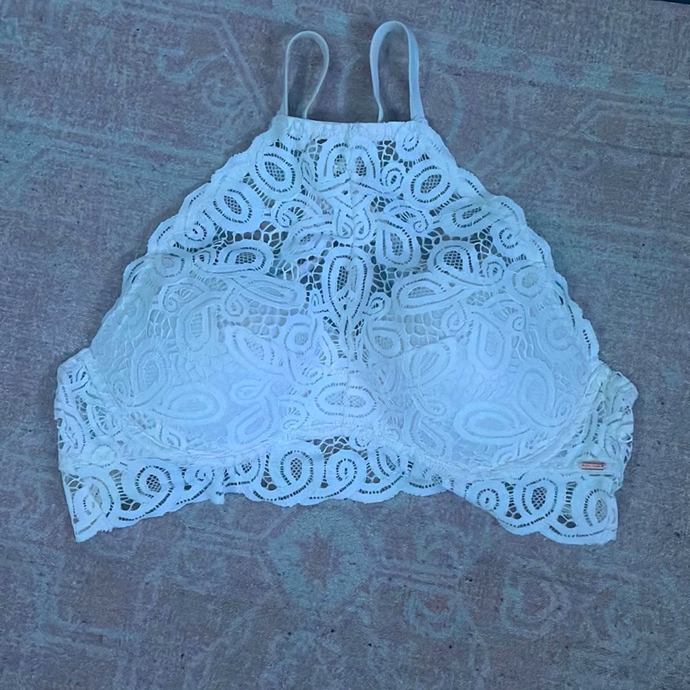 Pink bra , Size L , White lace with pink pads on the inside , adjustable strap